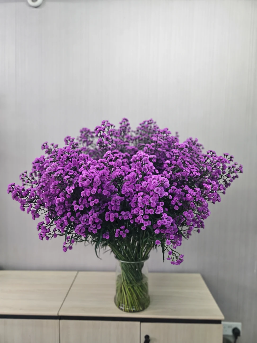 Purple Asters arranged in a glass vase
